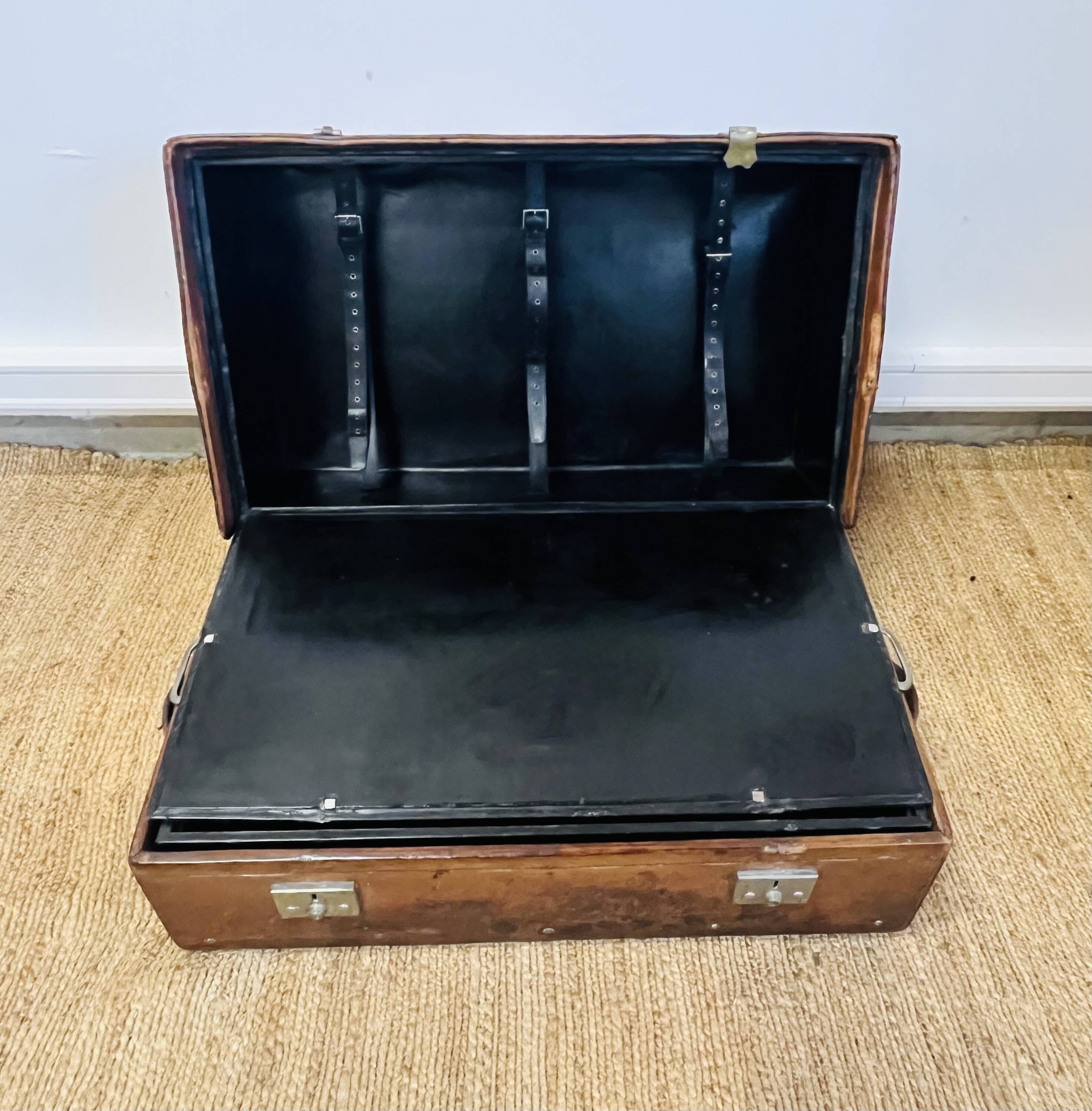 Large Gustave Keller leather trunk with multiple compartments