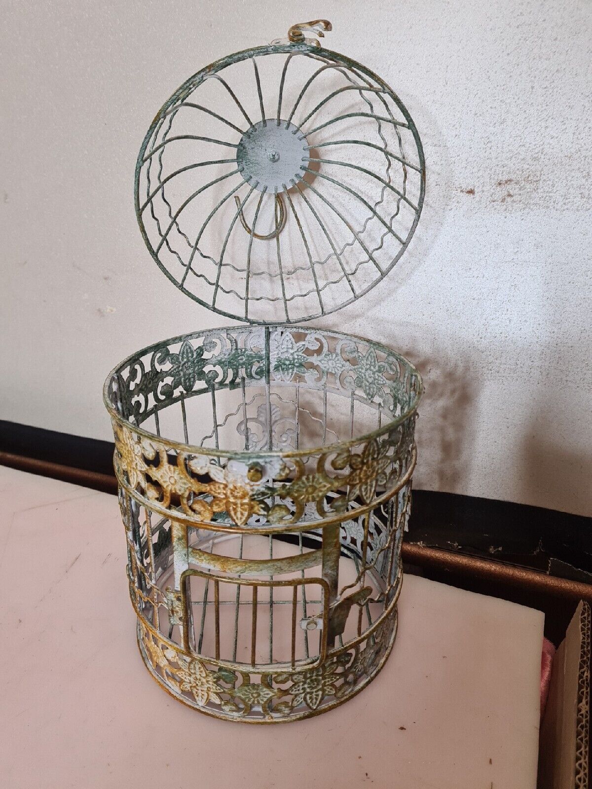 Round weathered iron birdcage