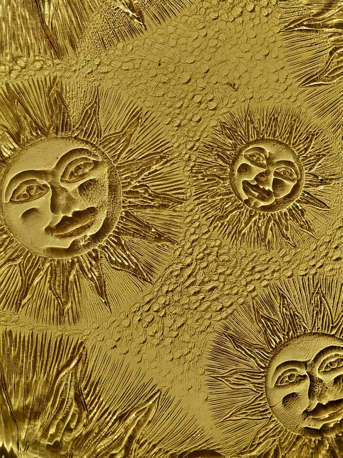 Glass plate decorated with suns, 1980.