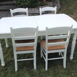 White farmhouse table set and four chairs