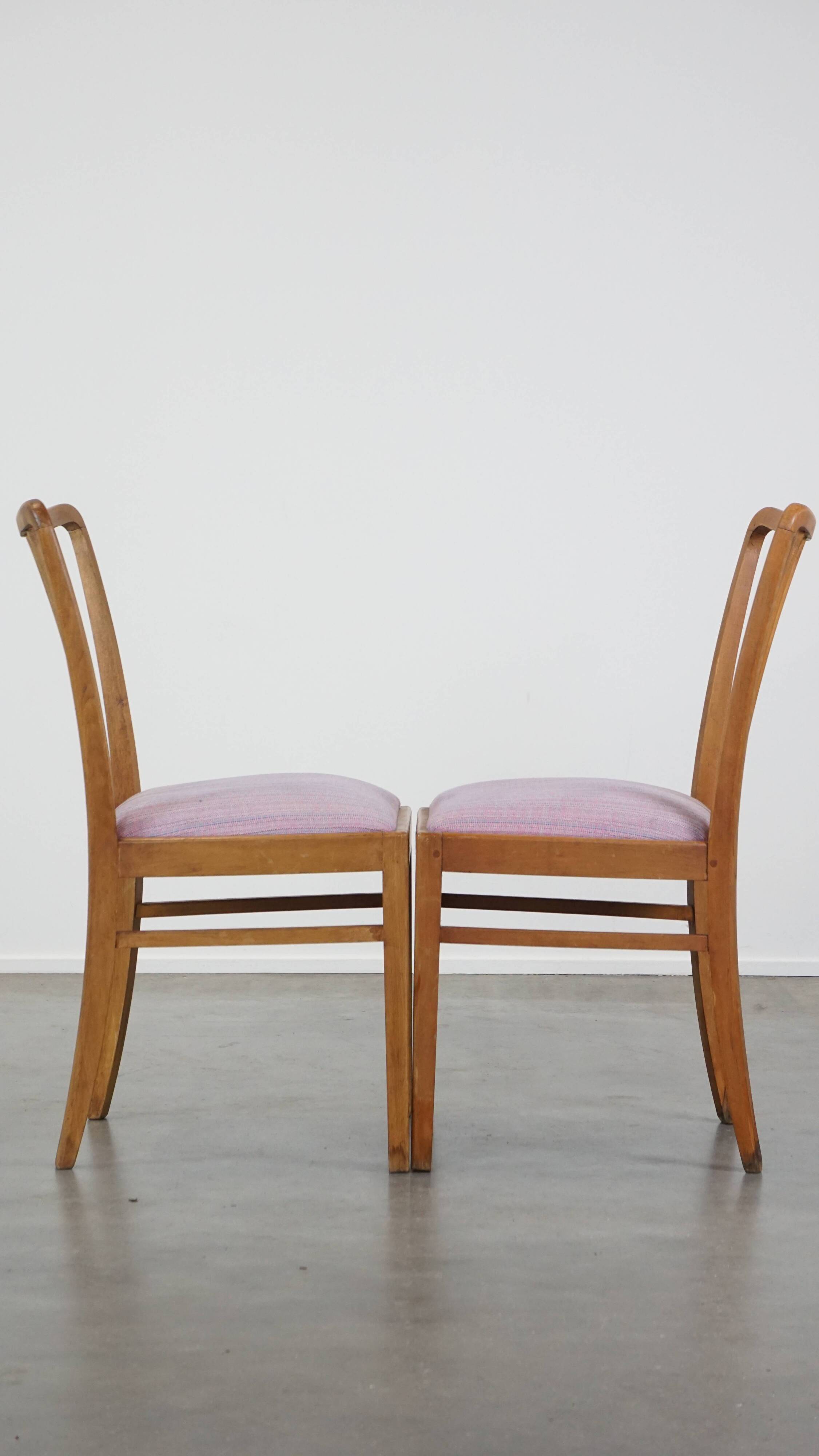 Set of 8 vintage Danish design dining chairs from the 1970s with light purple fabric seats