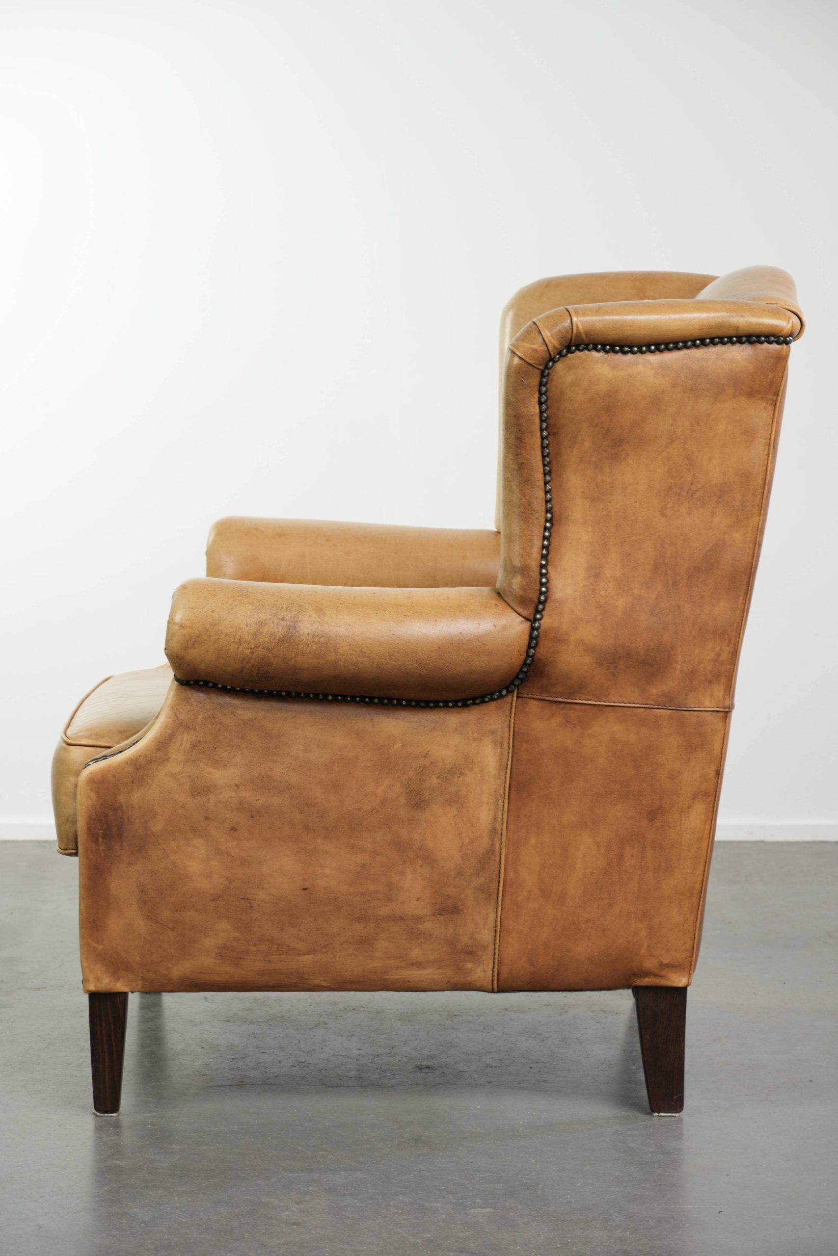 Cow leather wingback armchair with a beautiful timeless English look