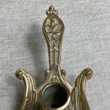 Bronze hand candlestick in the shape of a peacock