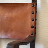 Frailero armchair, antique Spanish — carved wood & full-grain leather.