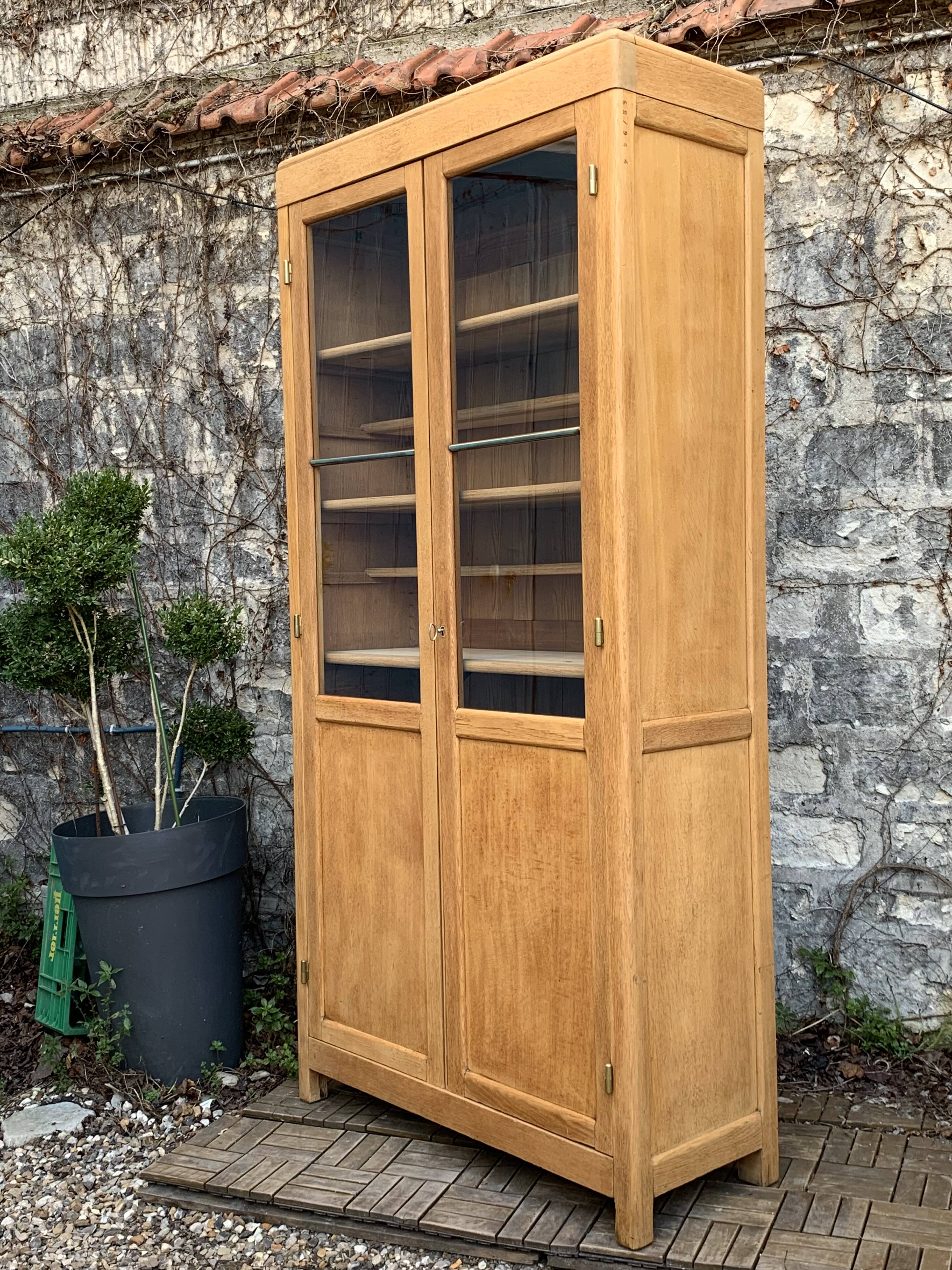 Parisian glass cabinet in solid raw oak, 1950