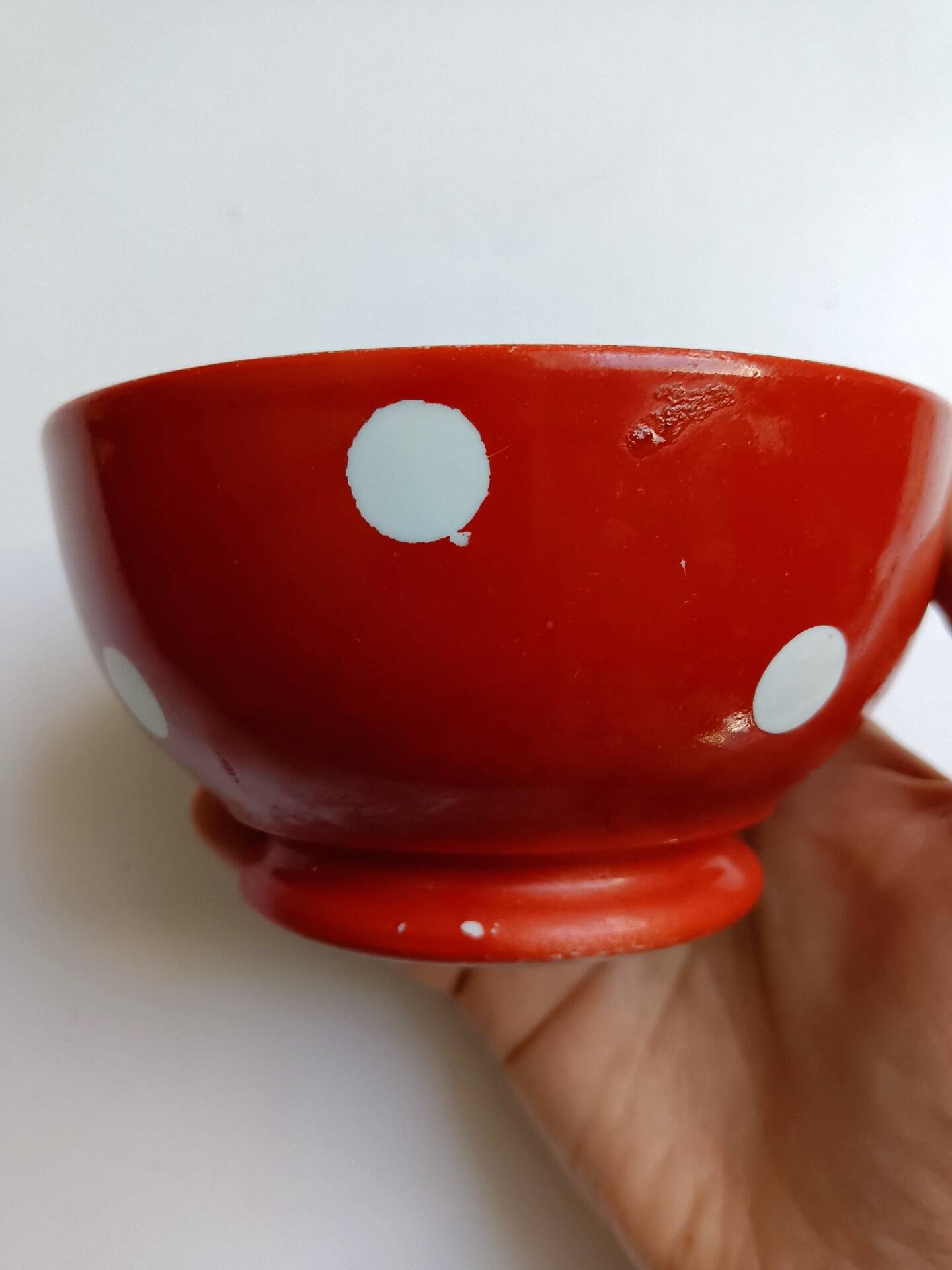 Red bowl with white polka dots in Longchamp ceramic
