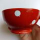 Red bowl with white polka dots in Longchamp ceramic