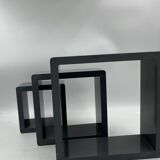 3 nesting shelves in grey lacquer.