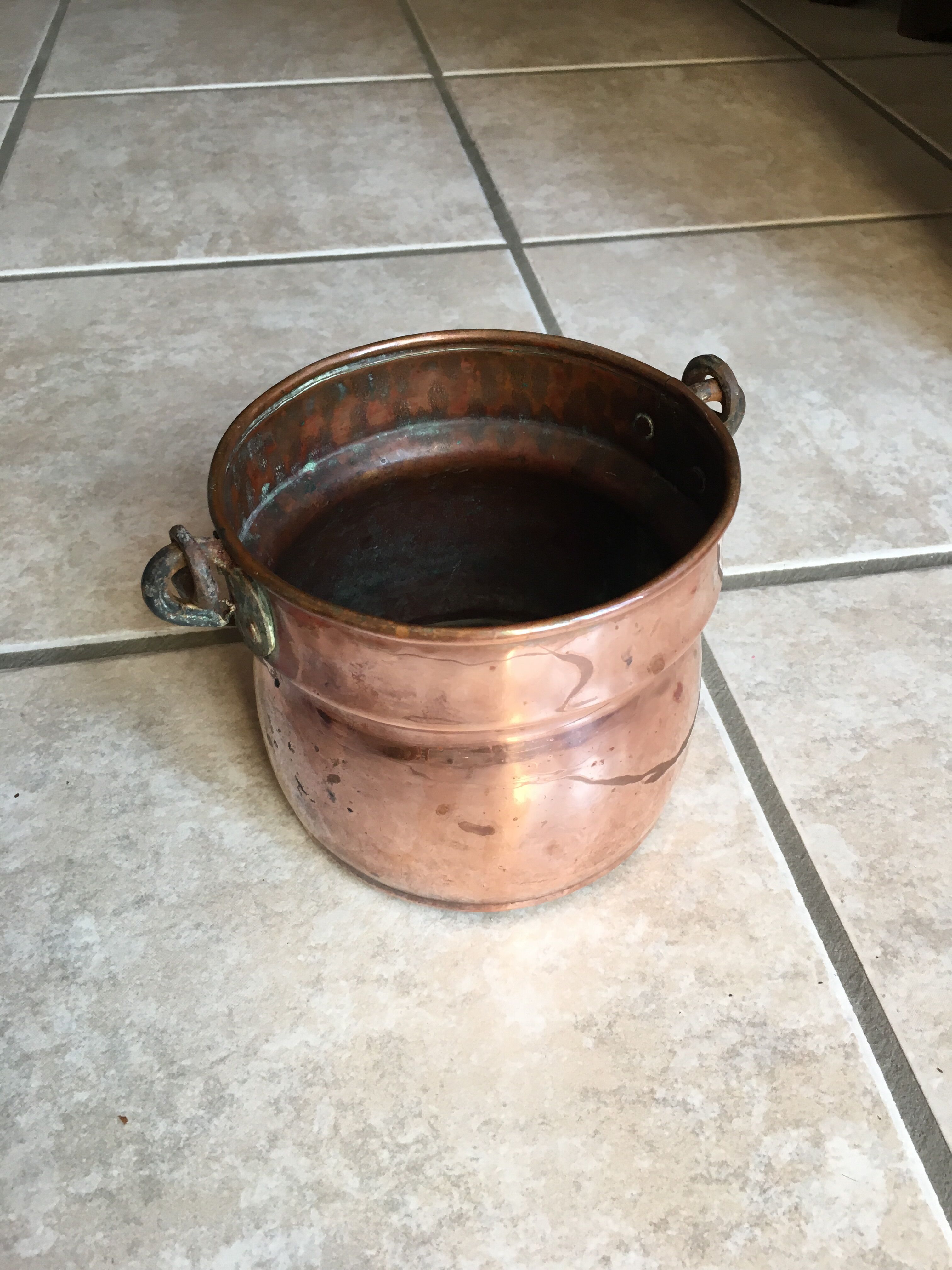 Old copper pot cover with cove