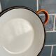 Orange enameled sheet egg dish