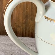 Antique porcelain jug with Limoges enamel