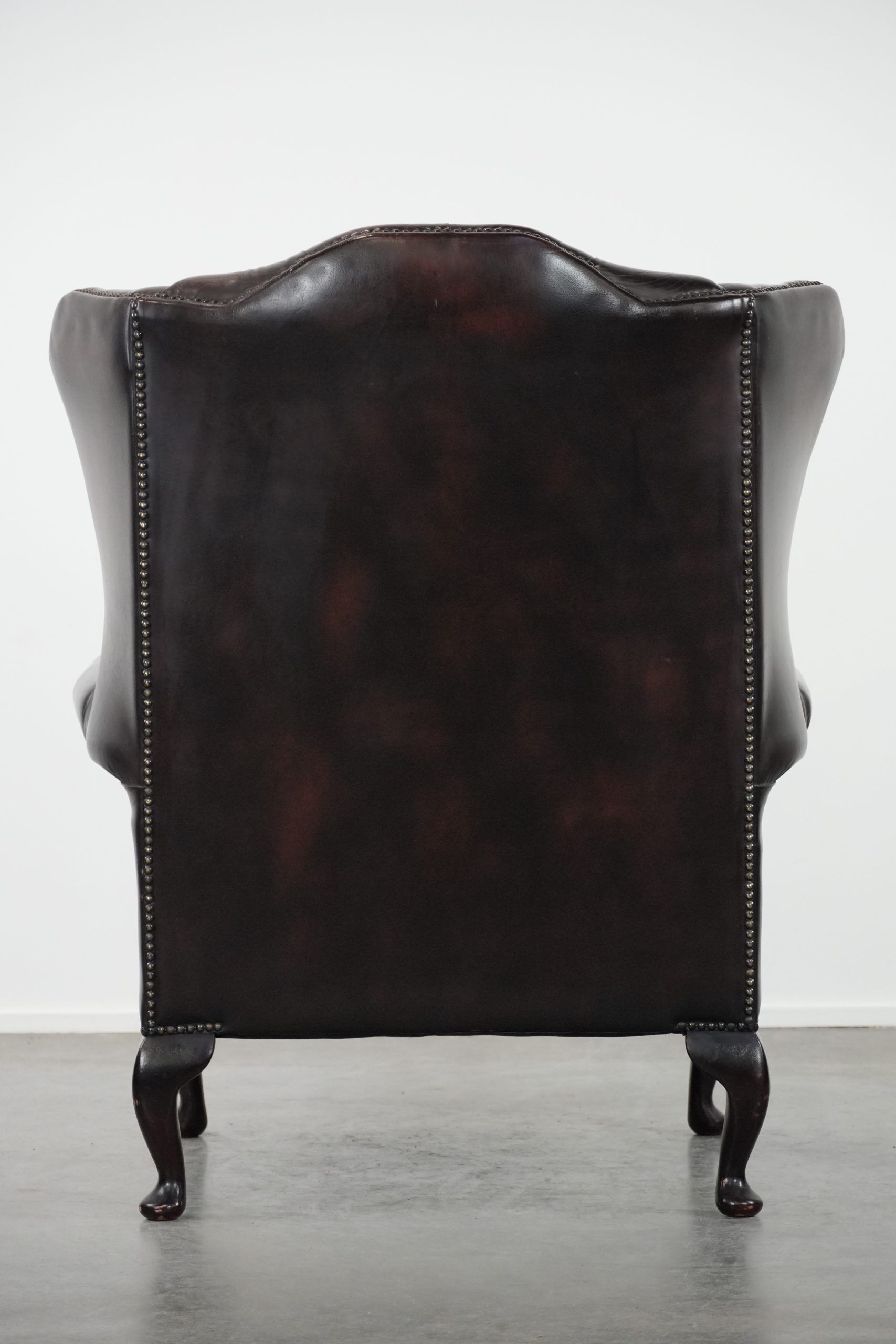 Cowhide leather Chesterfield wingback armchair in classic English style