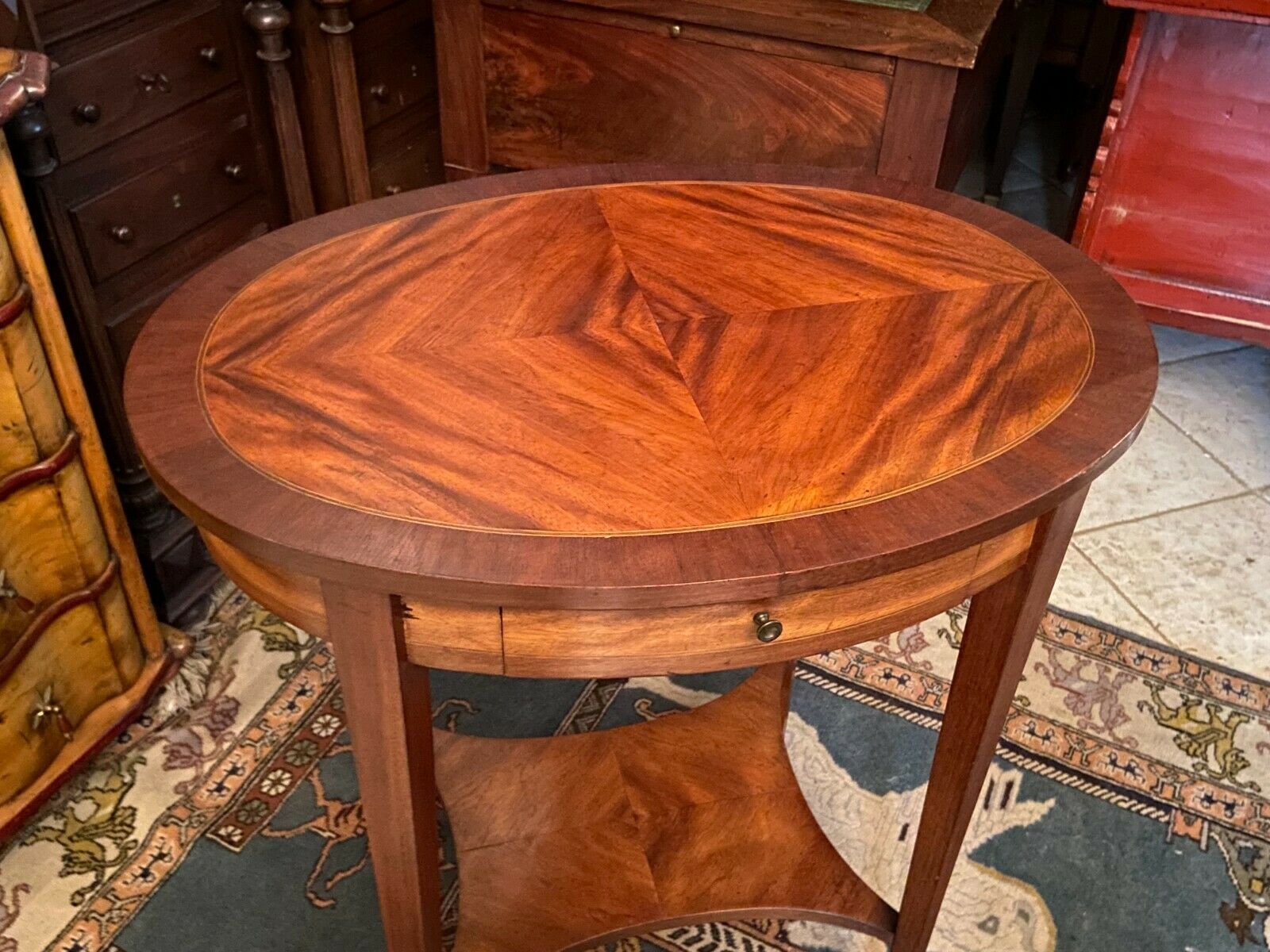 Oval pedestal table with a drawer and a tablet decorated inlaid Louis XVI style