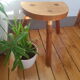 Massive wooden tripod stool