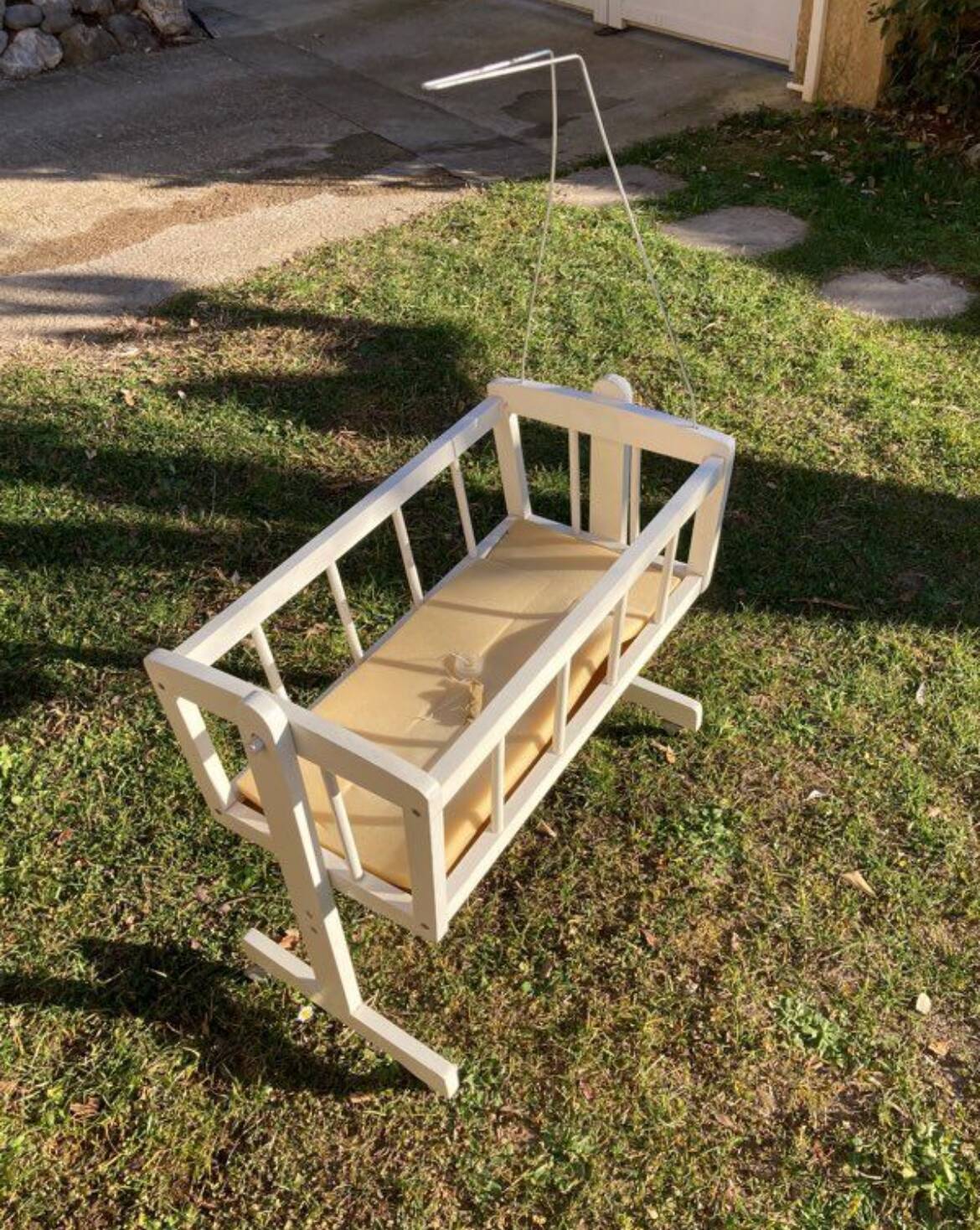 Complete wooden doll cradle on wheels