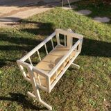Complete wooden doll cradle on wheels