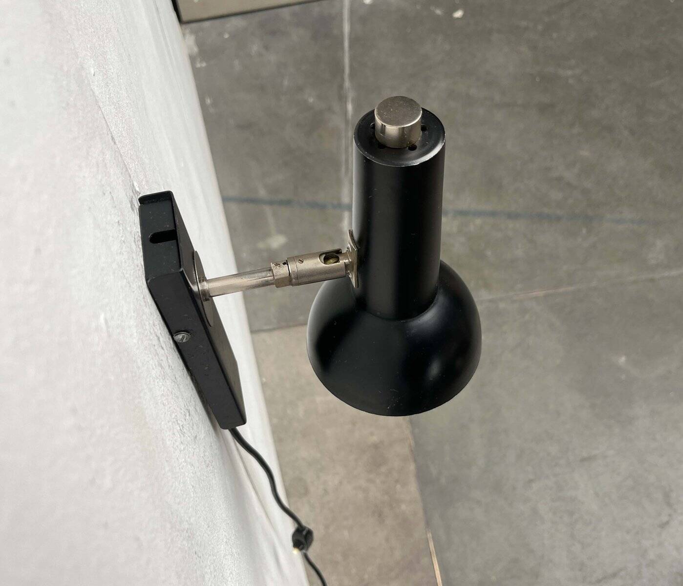 Mid-century German black minimalist wall lamp by Hustadt, 1960s.