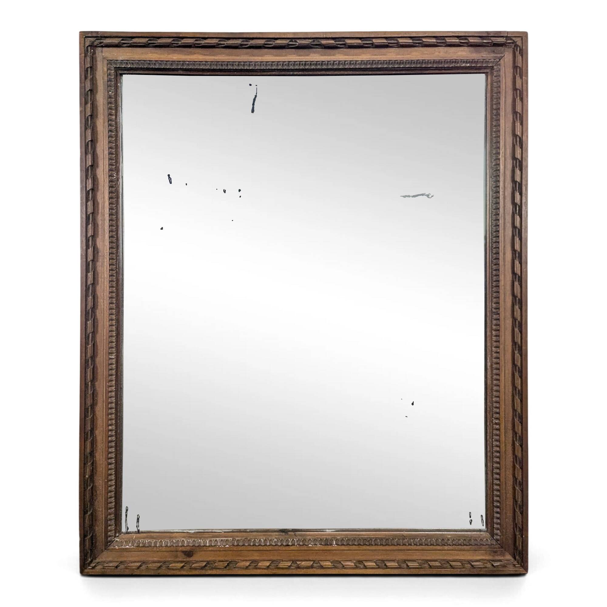 Miroir Napoléon III à cadre en bois sculpté et doré