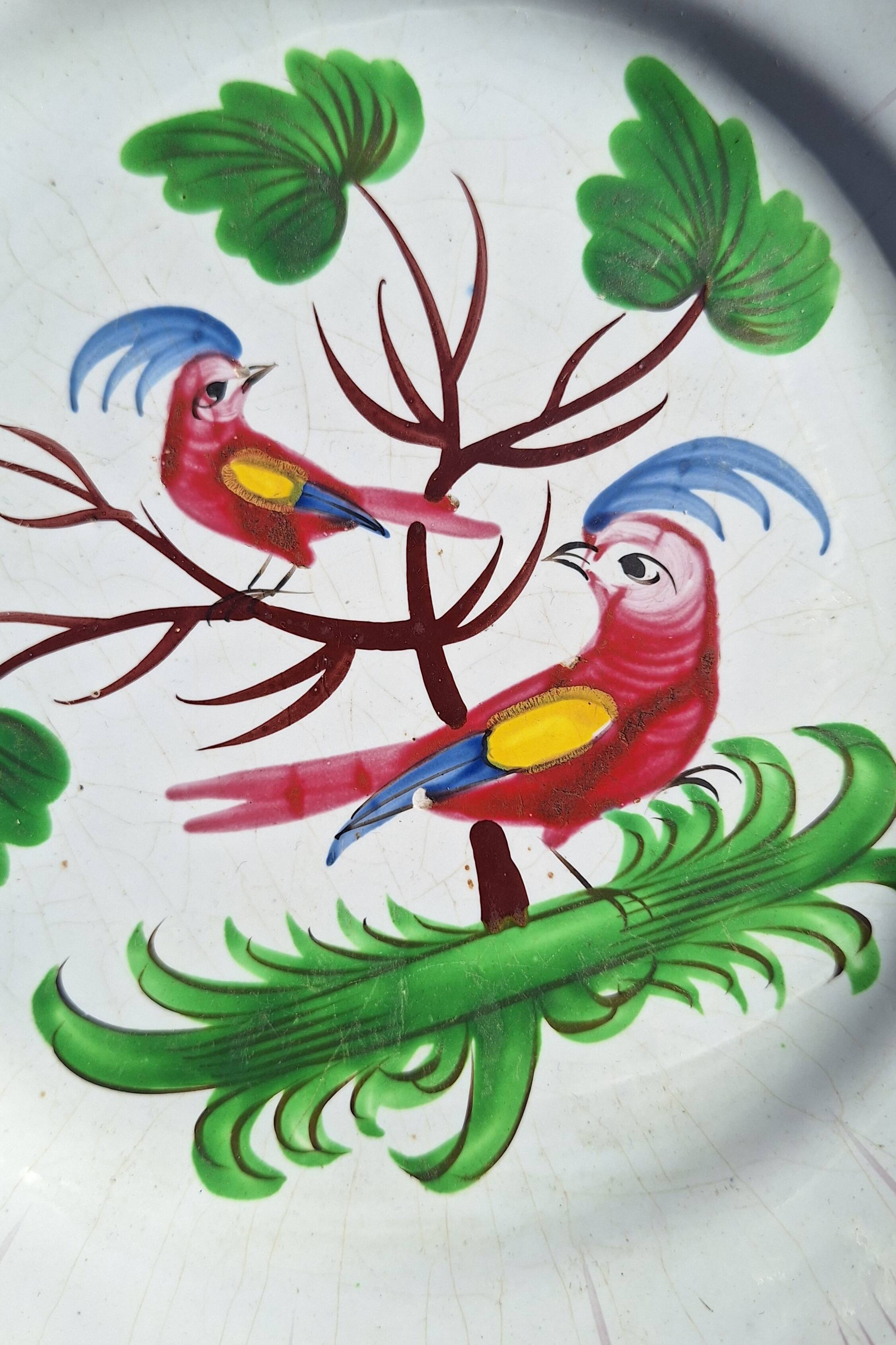 Eighteenth-century earthenware plate decorated with parrots.