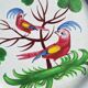 Eighteenth-century earthenware plate decorated with parrots.