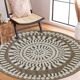 Round jute rug with white relief patterns.
