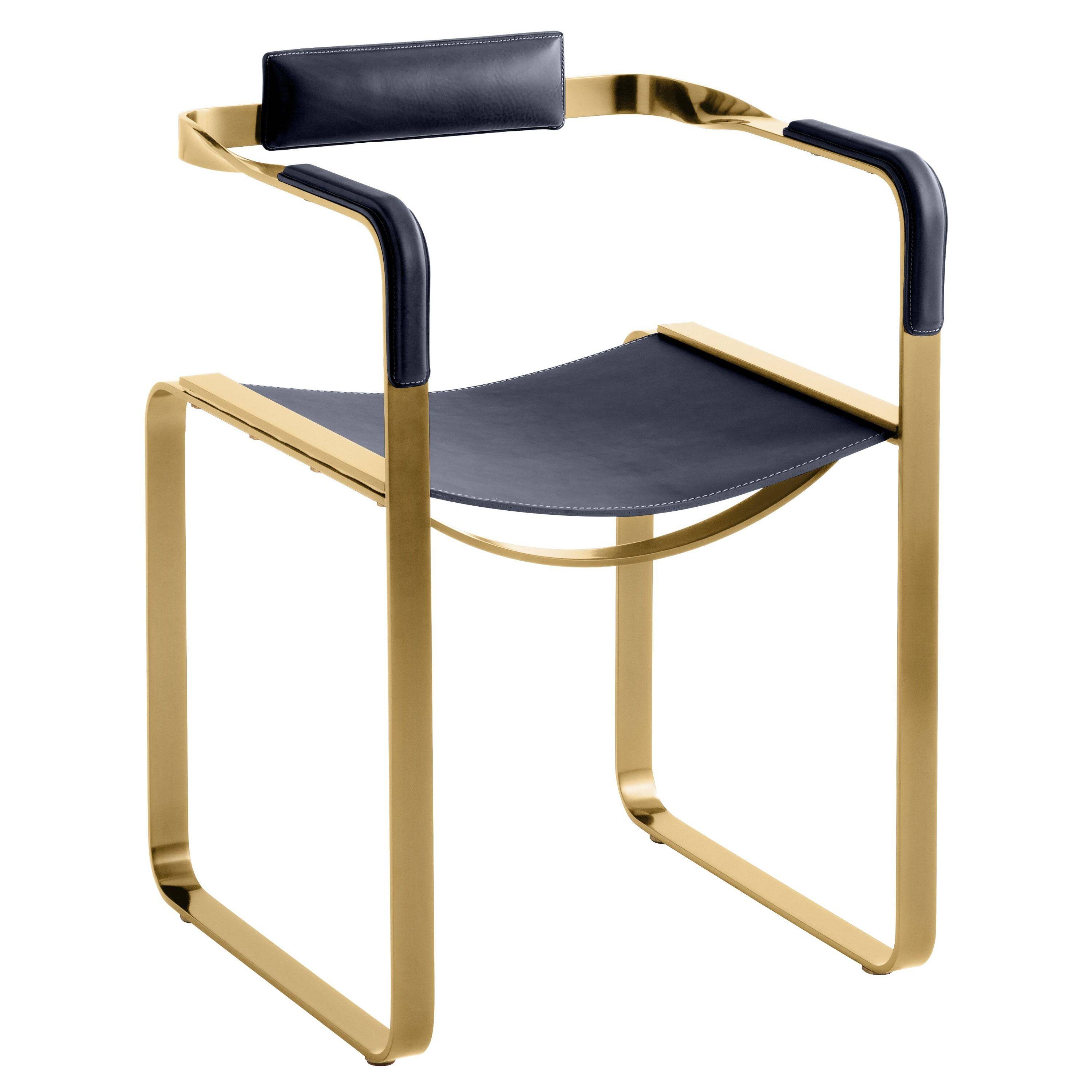 Armchair, aged brass and navy blue leather, contemporary style.