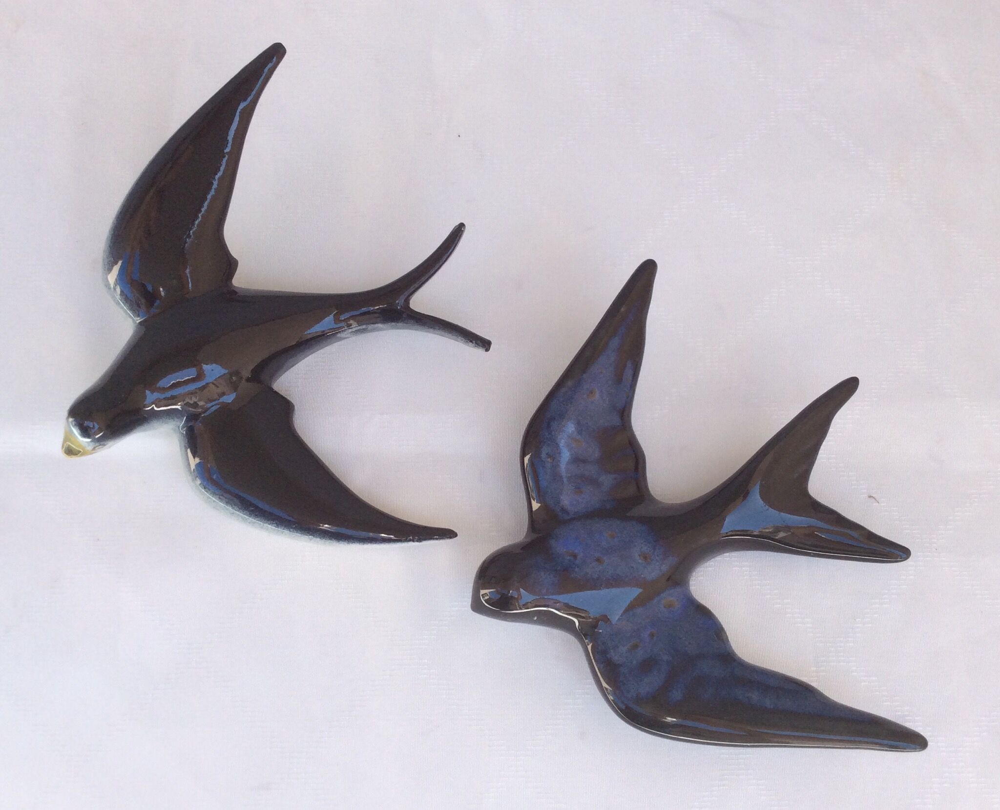 Two ceramic wall swallows