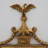 20th Century gilded wooden Empire style mirror with eagle on top
