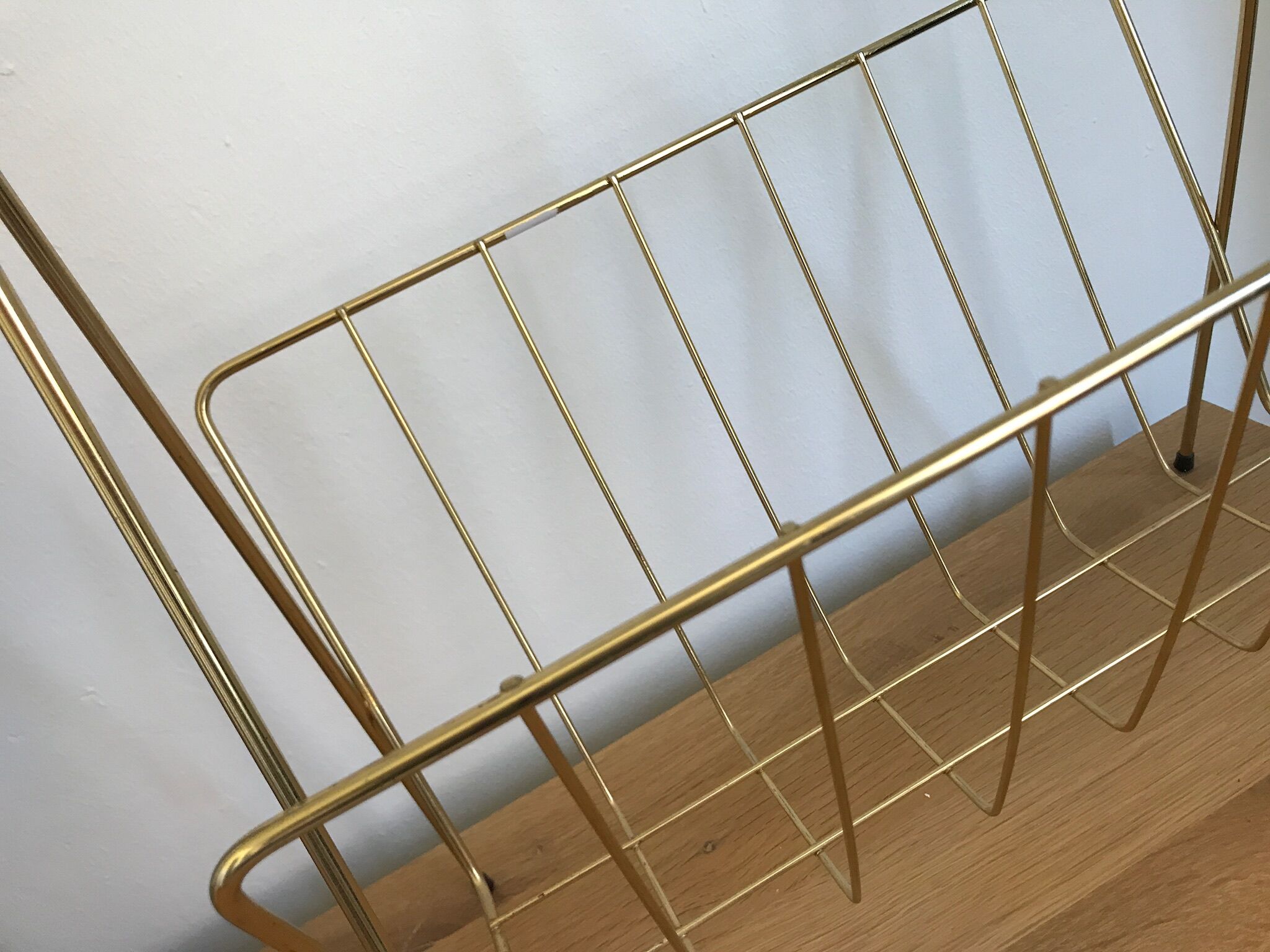 Gold metal magazine rack