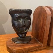 Pair of bronze bookends with masks