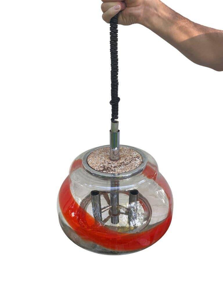 Vintage Murano glass pendant light with orange accent.