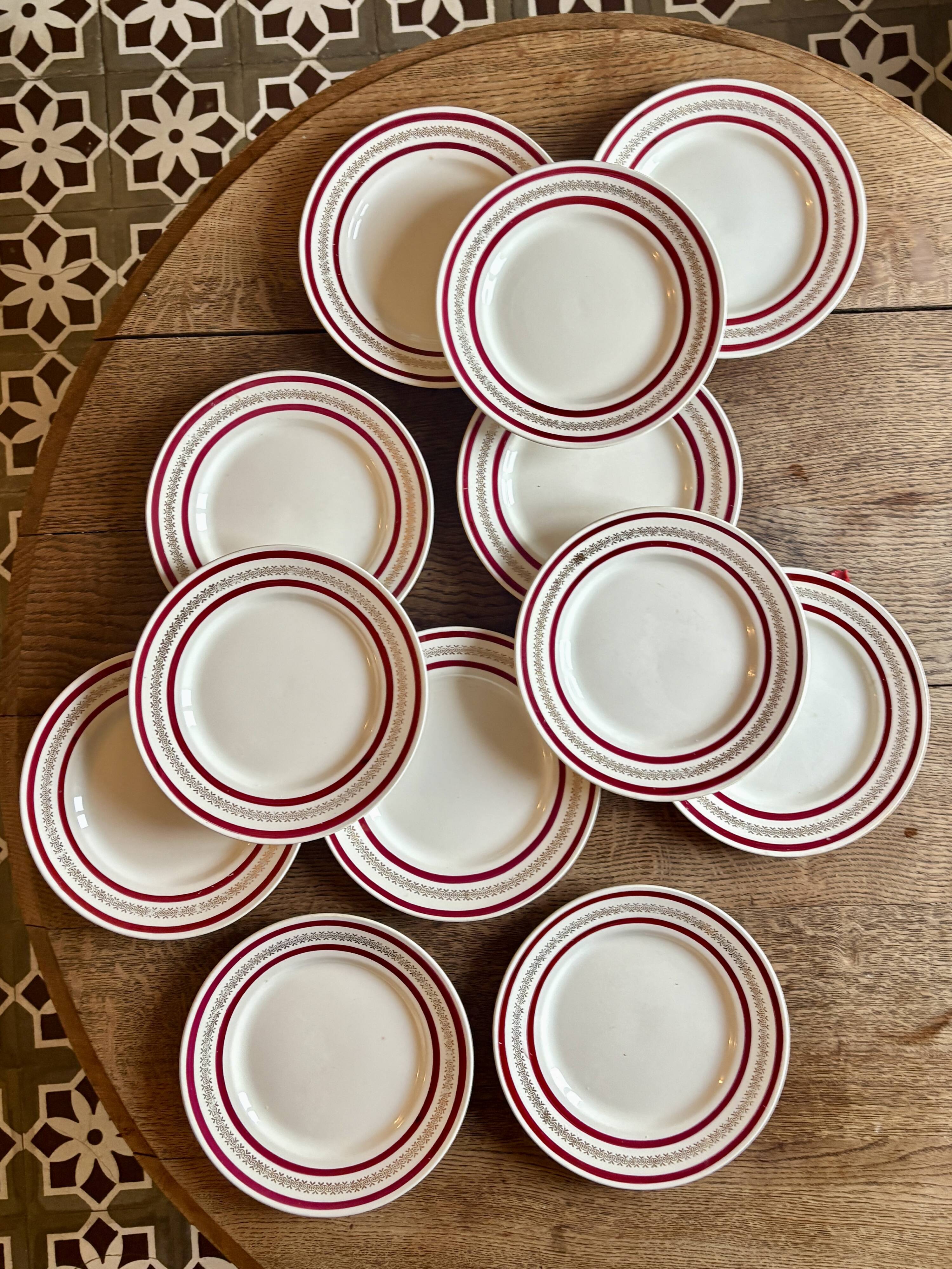 Set of 12 antique Gien red and gold dinner plates.