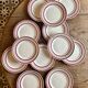 Set of 12 antique Gien red and gold dinner plates.