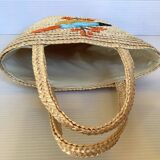 Old woven straw basket embroidered raffia