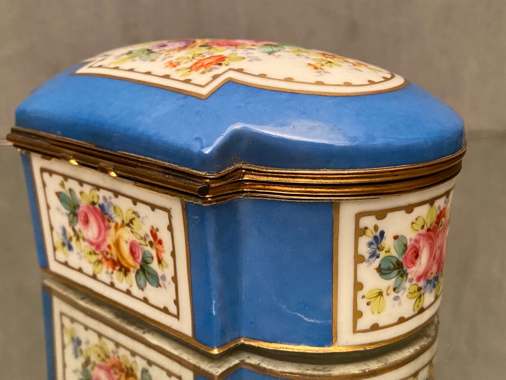 Domed porcelain box polychrome floral decoration on blue background brand Sèvres