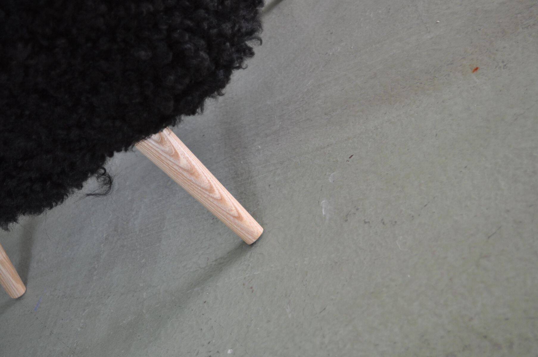 Mid-century black cocktail chair in lambskin, beech legs — 1960s