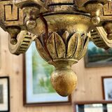 Golden wooden chandelier with crystal pendants from the 19th century.