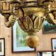 Golden wooden chandelier with crystal pendants from the 19th century.