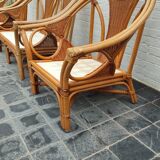 Set of 2 rattan armchairs with a bench.