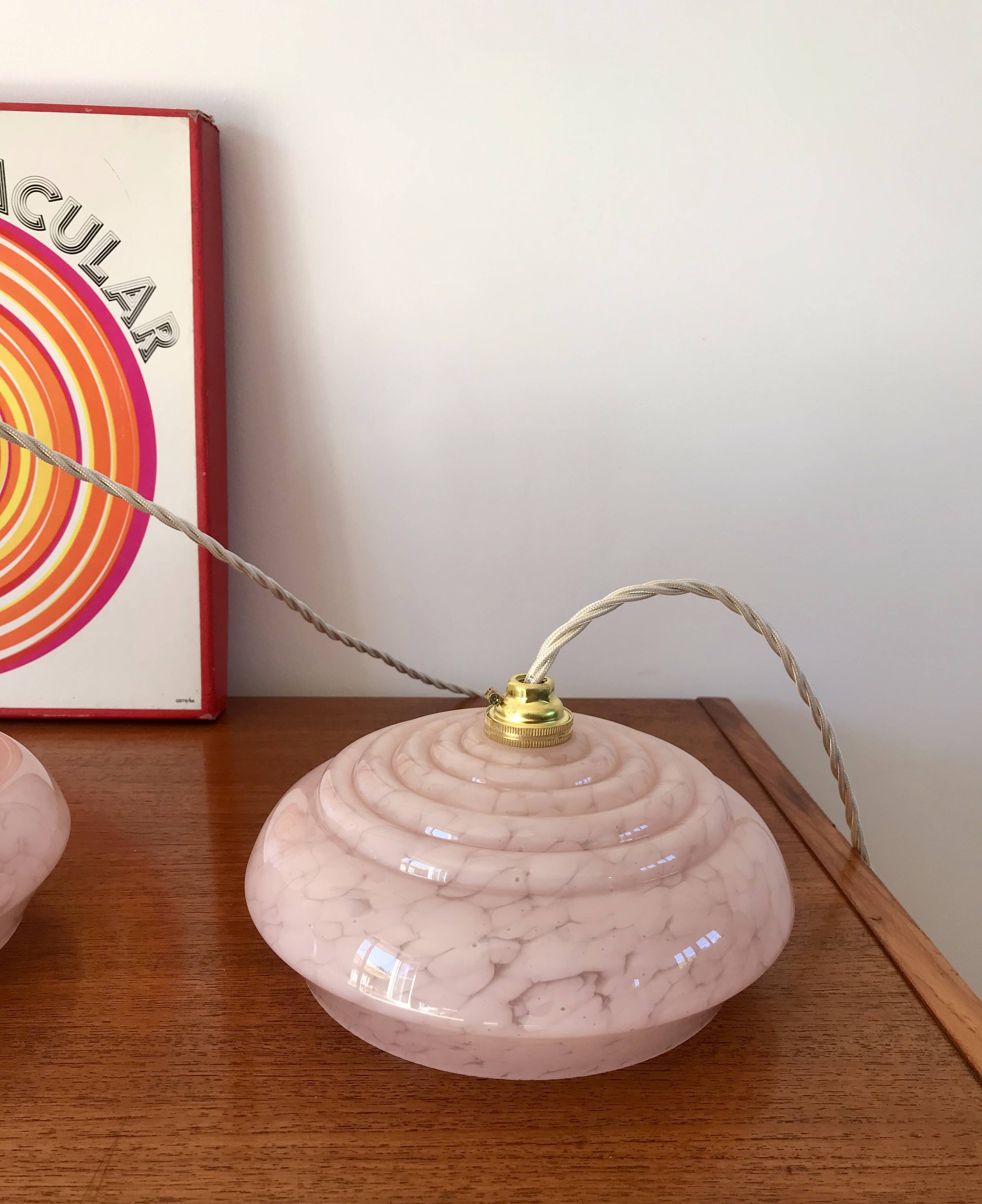pair of candy pink Clichy glass pendant lights from the 1950s