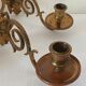 Pair of antique wall-mounted brass candle holders