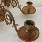 Pair of antique wall-mounted brass candle holders