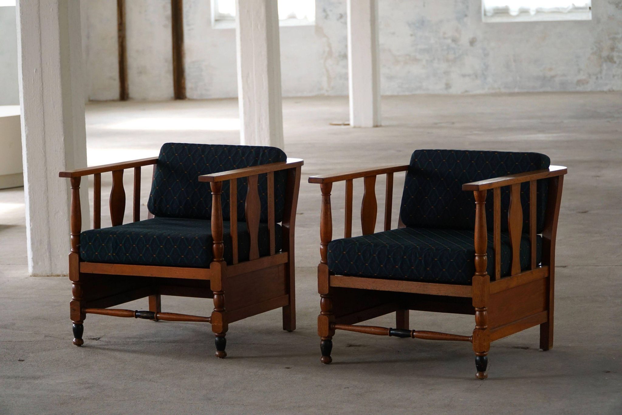Art Nouveau, pair of oak lounge chairs, reupholstered in style fabric, 1920s.