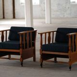 Art Nouveau, pair of oak lounge chairs, reupholstered in style fabric, 1920s.