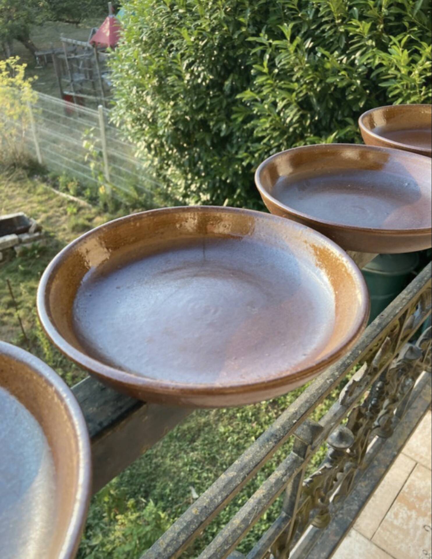 Deep plates made of organic, wild, earthy marsh clay.