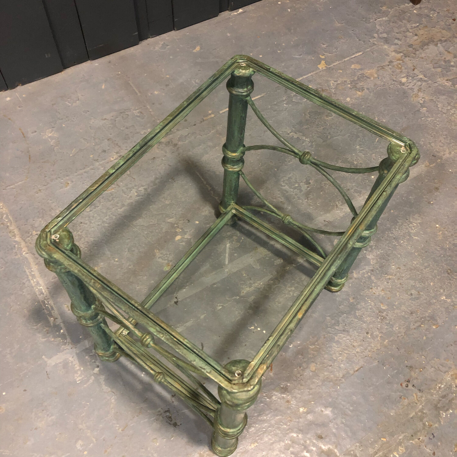 Iron and glass side table with antique patina