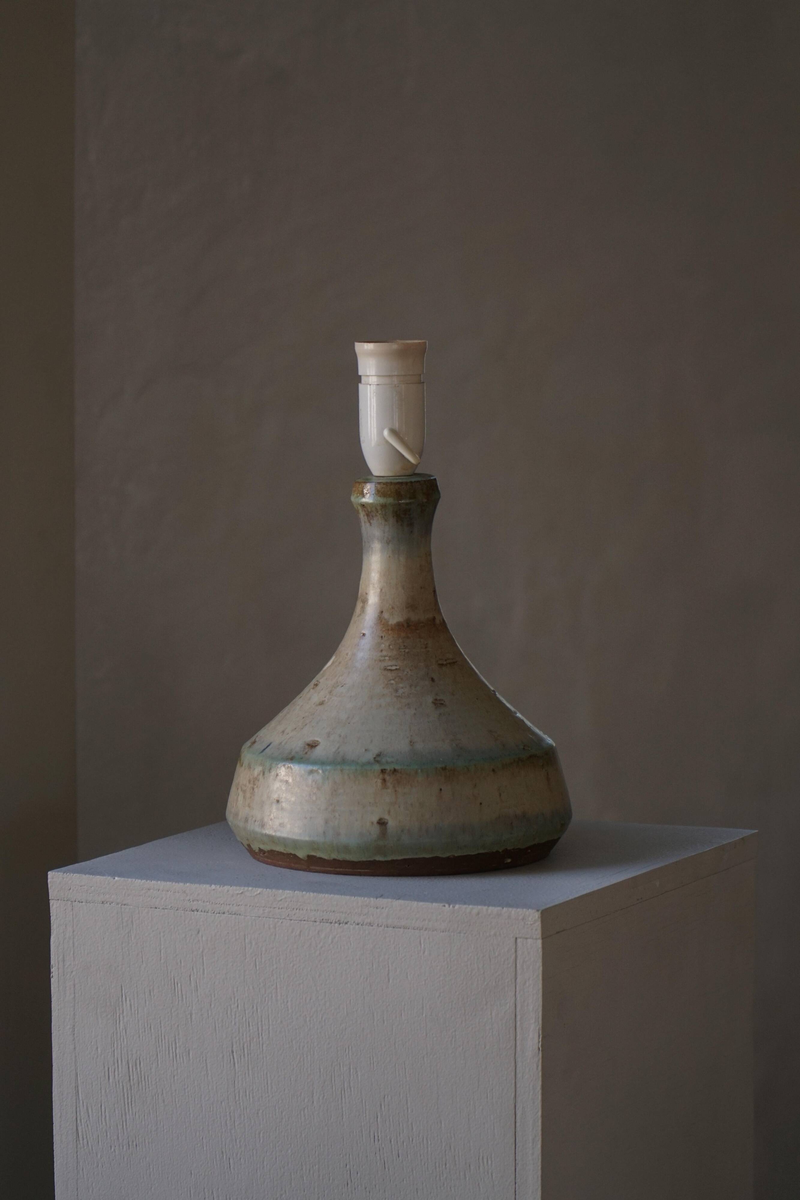 Modern Danish decorative table lamp in stoneware with flared base, Denmark, 1960s.