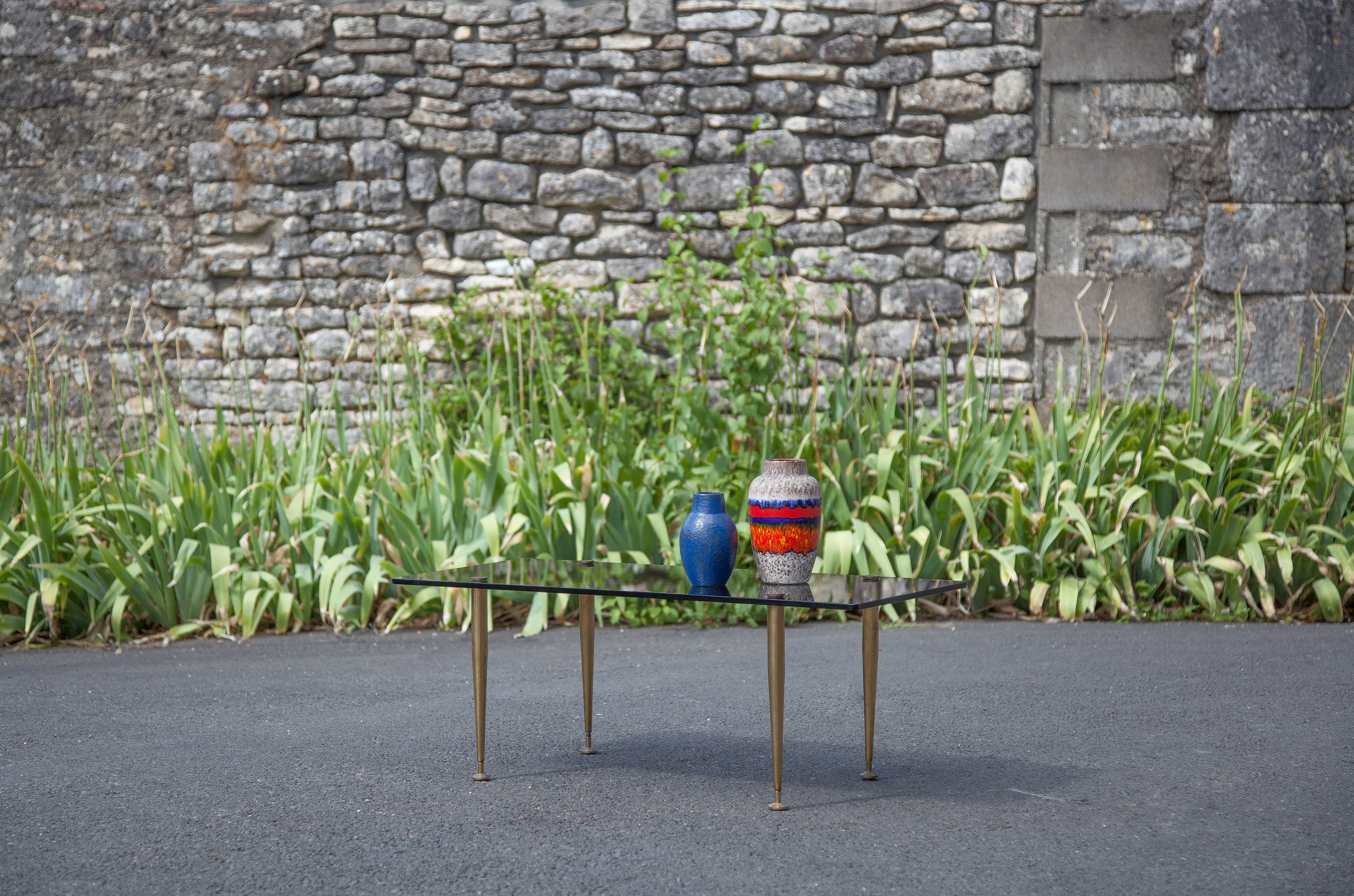 Smoked glass coffee table with adjustable brass legs, end of sofa, 70s table