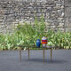 Smoked glass coffee table with adjustable brass legs, end of sofa, 70s table