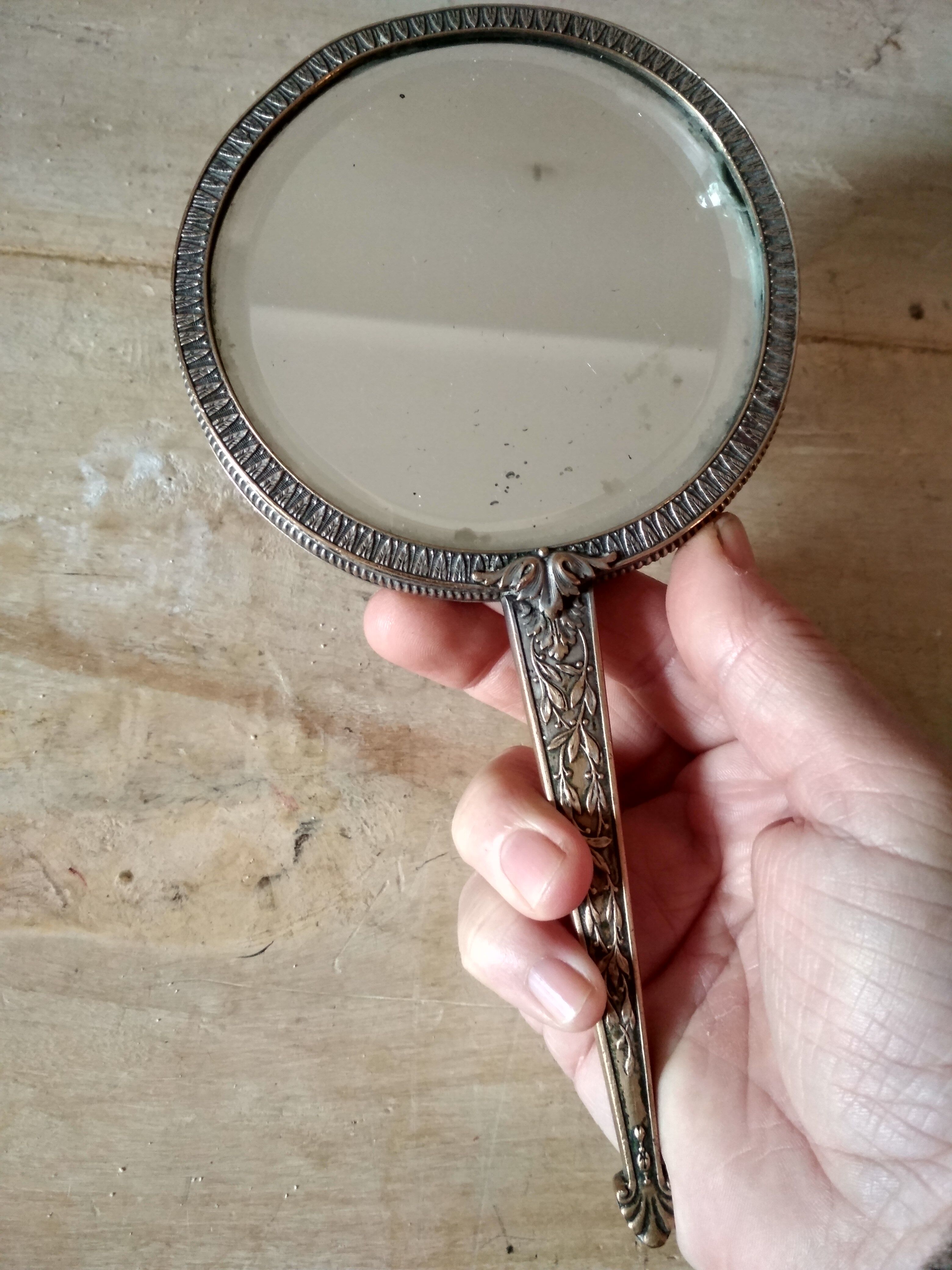 Old hand mirror beveled glass